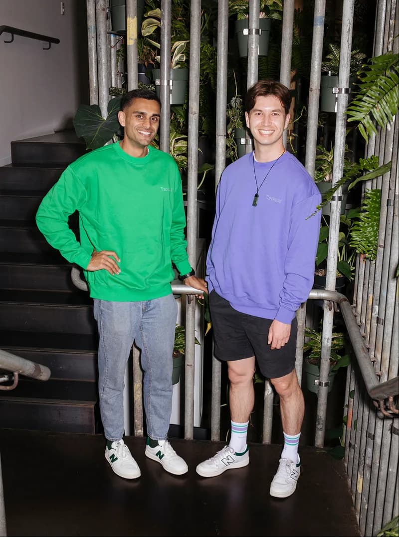 Tracksuit colleagues on a staircase